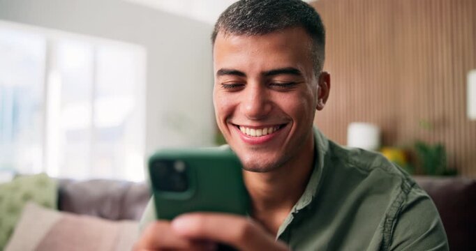 Reading, smile or man with phone in lounge, check digital photo album or typing response for web chat. Texting, laugh or happy person with mobile for message notification, home or browsing internet