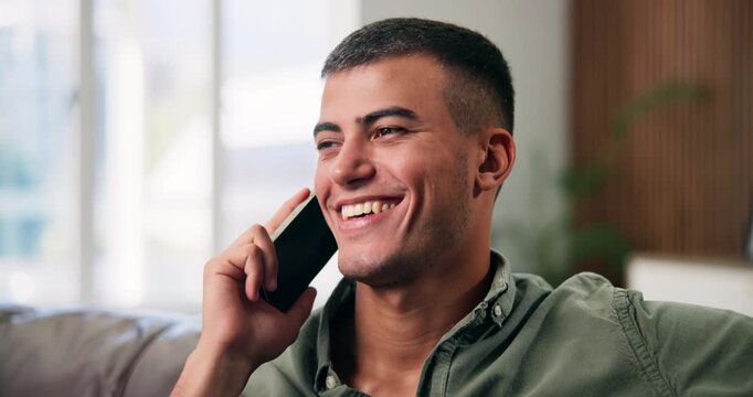 Happy man, listening and laughing with phone call in home for funny joke or conversation. Male person, talking and smile with mobile smartphone for friendly discussion, chat or communication in house