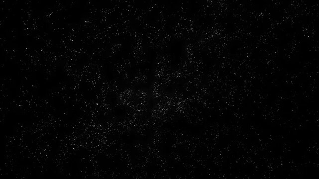 Abstract scattering of tiny bright white particles floating on a deep black background, creating a cosmic star field effect. Perfect for space themes, galaxy visuals, cinematic motion and overlays 