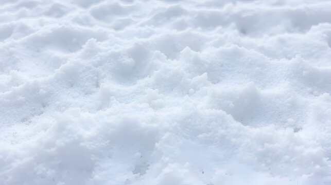 A captivating and textured close-up of a field of undulating powdery substance, reminiscent of a snowy landscape
