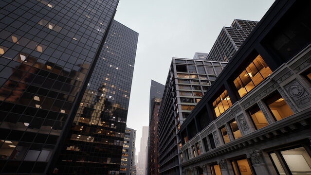 Moody urban canyon glass skyscrapers dusk, low angle view of narrow street flanked by mirrored towers and ornate stone facade, warm office lights glowing