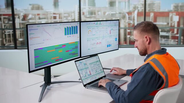 Industrial Engineer Monitors Computer System Controlling Automated Gas