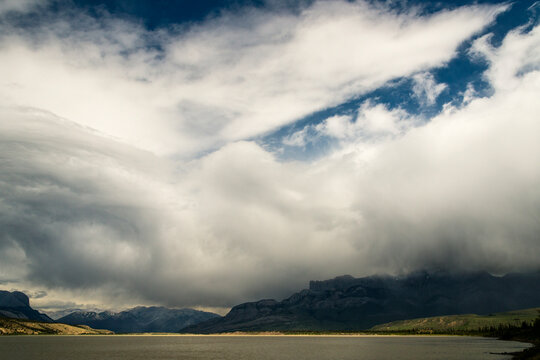 Canada, Alberta.  Billowing clouds over lake in Jasper National Park