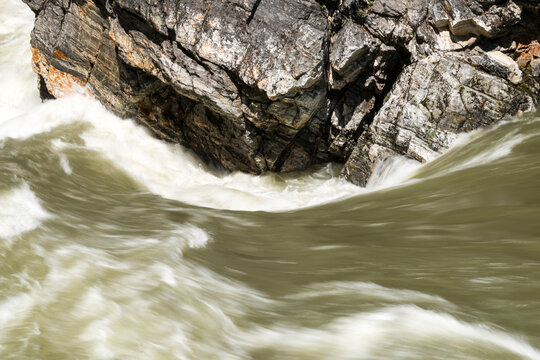 Canada, BC, Valemont.  Water surging around rocks in Little Hells Gate Park on the North Thompson River