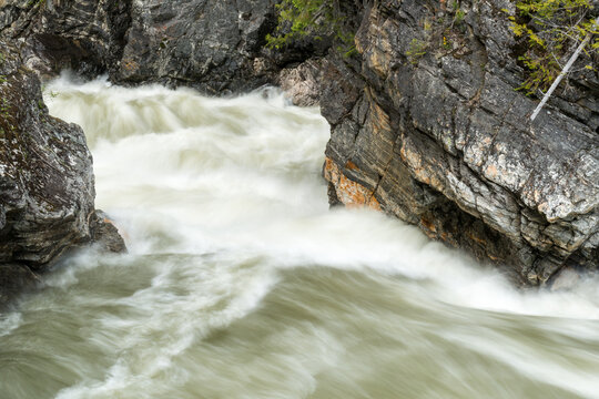 Canada, BC, Valemont.  Water surging around rocks in Little Hells Gate Park on the North Thompson River