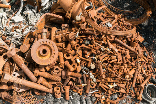 Canada, BC, Ashcroft.  A pile of rust covered nuts and bolts and other debris in the remains of a auto repair shop after fire.