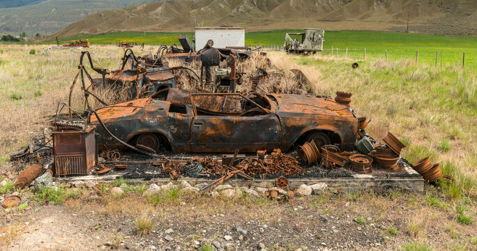 Canada, BC, Ashcroft.  Rusted remains of burned up automobile.