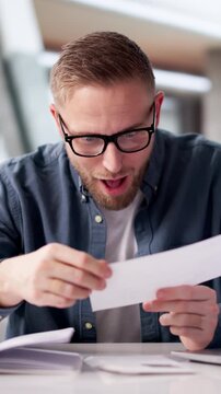 Businessman Happily Holding Paycheck