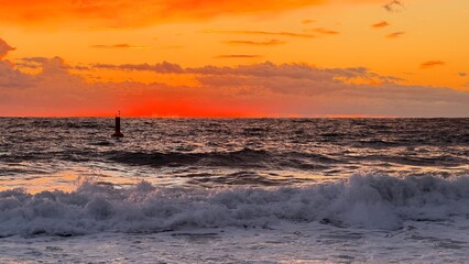 Obraz premium Beach sunset waves. stunning bright colorful sky, seascape. High quality 4k footage