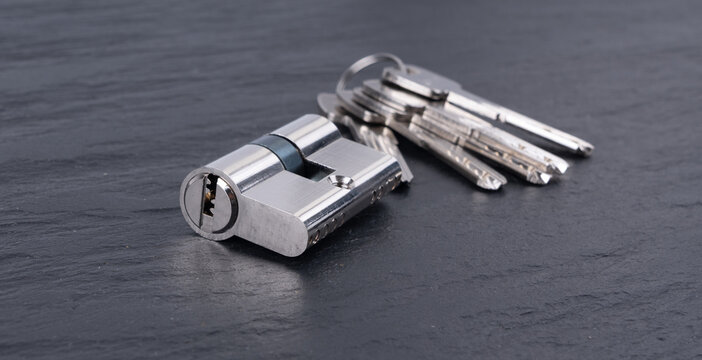 Keys and lock cylinder for door lock. Pin tumbler components ready to replace or repair