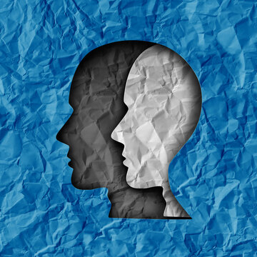 Bipolar Disorder as a mental health disease with recurring shifts between periods of elevated happy mood and periods of depression and sadness as a head shape made of paper symbol as a psychology and 