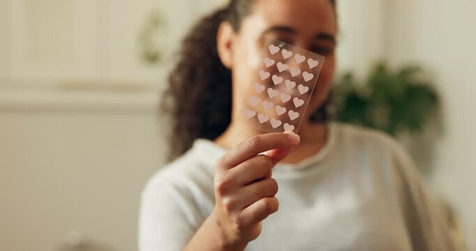 Woman, hand and pimple patch in bathroom with skincare, breakout coverage and wellness benefits. Female person, zit sticker or cosmetic product in house for acne treatment, blackheads or dermatology.