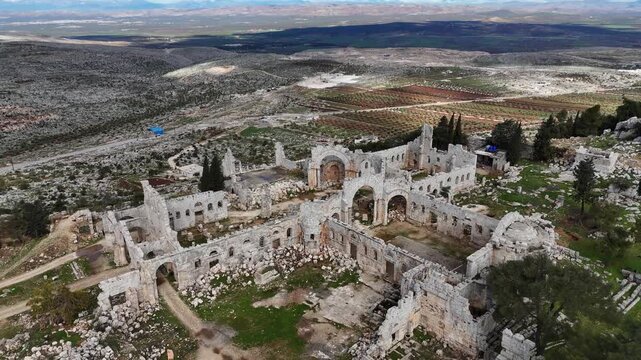 drone approaching historic St. Simons church ruins in Syria, showcasing the intricate architectural heritage of the Byzantine era