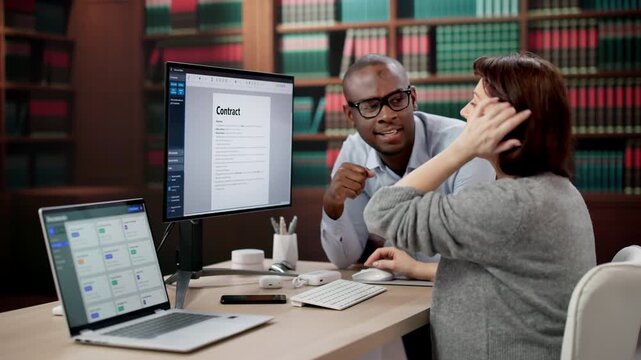 Lawyers Reviewing Contracts On Computer