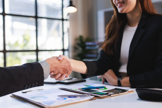 Business people shaking hand sealing partnership agreement