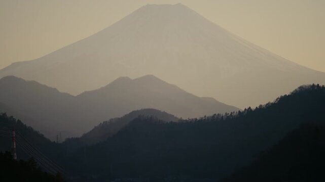 Iconic Japanese volcano Mount Fuji viewed from Otsuki city streets.