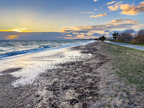 Sunset view toward Paralia Dionysou from Paralia Portaria beach, Chalkidiki, Greece