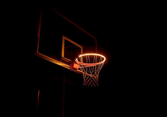 Naklejka premium The iconic basketball hoop glows under the lights, a symbol of the intense competition of the Basketball Final Four.