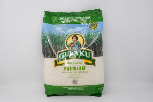 Packaged premium white rice with green branding on white background