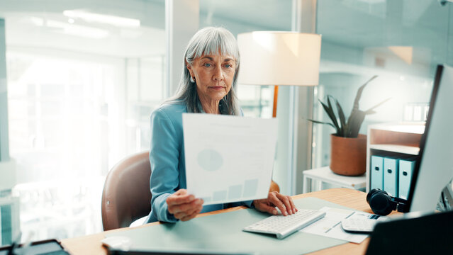 Investor, computer and woman in office, documents for revenue stats and profit increase for business. Mature person, financial advisor and paperwork for trading portfolio or report for company audit