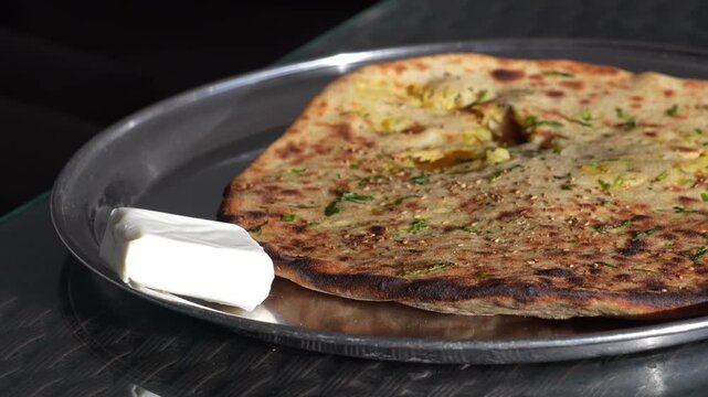 Indian Aloo Paratha with Butter Served on Plate Traditional Punjabi Breakfast