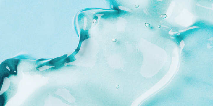 Transparent hyaluronic acid gel on a blue background.