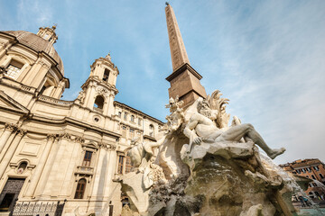 Fountain of the Four Rivers statue and Sant Agnese in Agone church in Rome Italy
