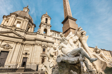 Obraz premium Fountain of the Four Rivers and Sant Agnese in Agone church at Piazza Navona in Rome Italy
