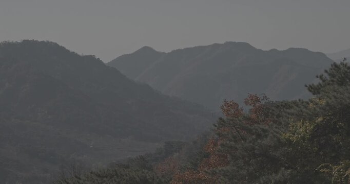 Serene Mountain Landscape with Autumn Colors and Peaks
