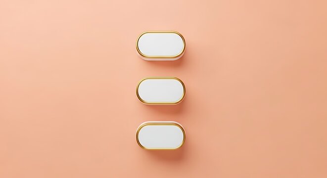 Three white and gold oval-shaped cabinet knobs arranged vertically on a peach background.