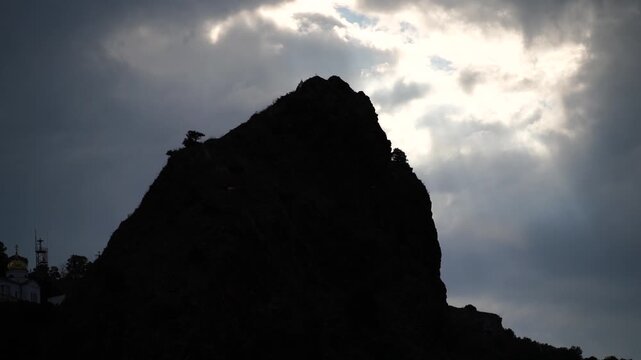 Clouds Landscape Peak: Mountain peak silhouetted under cloudy sky, daylight, for scenic beauty, dramatic view.