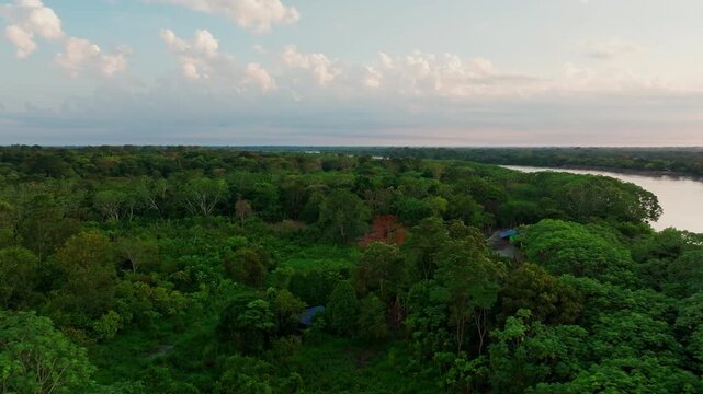 Aerial drone view of San Jos&eacute; del Guaviare shows tropical forest stretching around a river crossing in the heart of Colombia&rsquo;s Amazon landscape.