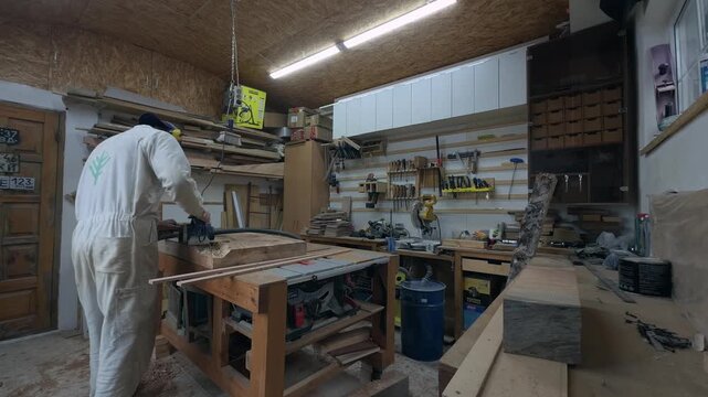 Solopreneur Woodworker Surfacing Custom Timber Slab in Small Business Workshop Wide Rear View