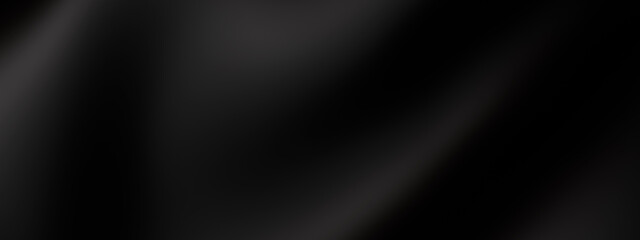 Elegant black silk fabric with flowing waves on dark background. Luxury satin cloth drapes create abstract 3d texture with soft ripples and smooth folds.