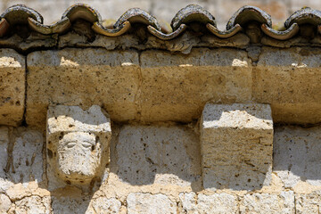 Detail of sculpted corbels under the eaves of the Church of San Cornelio and San Cipriano in San Cebrian de Campos © Agustin