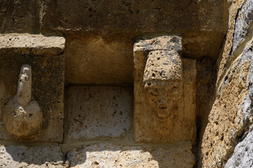 Detail of sculpted corbels under the eaves of the Church of San Cornelio and San Cipriano in San Cebrian de Campos © Agustin
