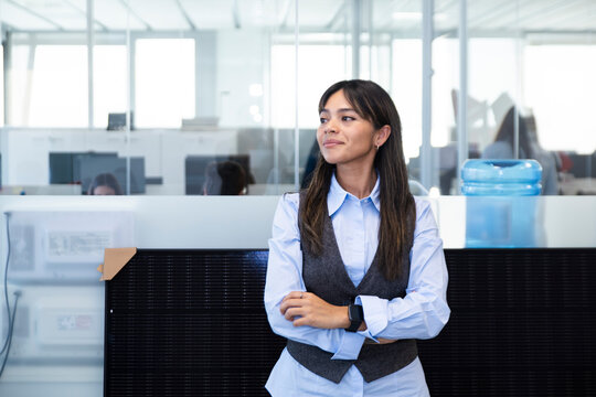 Professional employee in office with solar panel and business attire