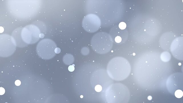 Abstract slate blue bokeh background with soft glowing light particles and elegant blurred orbs on grey gradient for professional corporate branding and cinematic video backdrop.