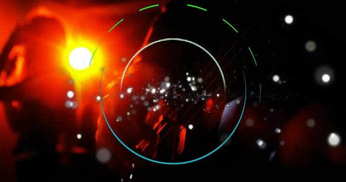 Male guitarist playing, left flare initiating HUD rings syncing bokeh, framing hands for music