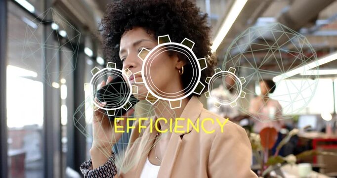 Office woman taking call at window ending call, tapping phone while cogs showing EFFICIENCY for biz