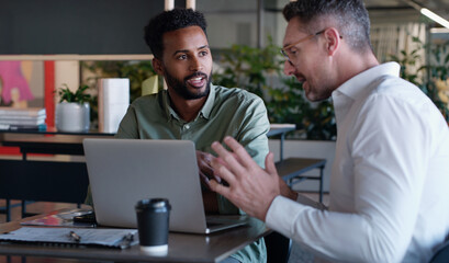 Team, meeting and men with laptop, office and advice for article on website, talking and...