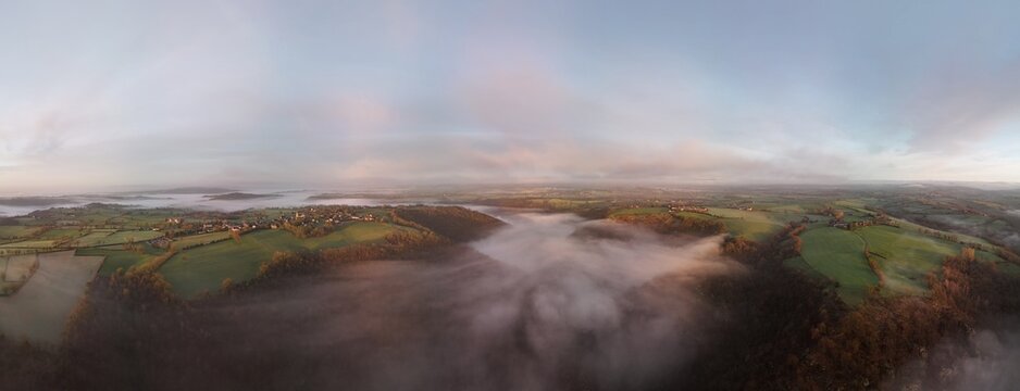 Hills countryside sunrise in morning fog - Arial drone view