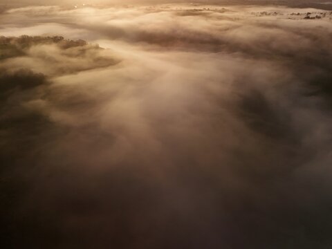 Hills countryside sunrise in morning fog - Arial drone view