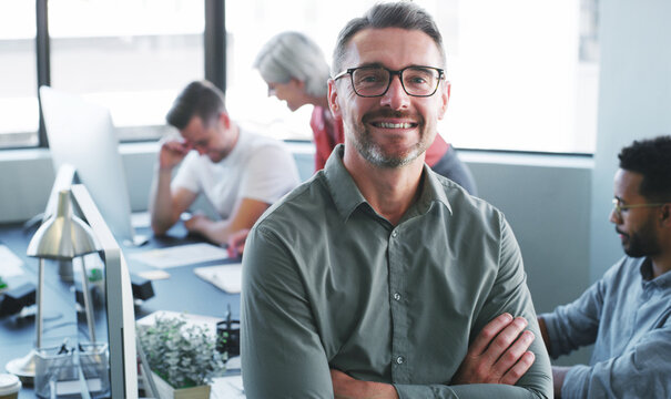 Creative, man and happy with arms crossed in office for journalism, career pride or about us. Staff, mature editor or portrait at agency for news reporting, publishing industry or editing experience