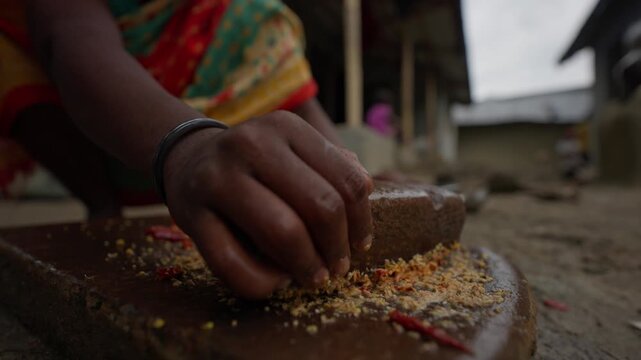 Hand carved Silauto Lohoro, a traditional stone grinder used for preparing spices, herbs, and condiments in South Asian kitchens. Represents cultural cooking tools and heritage food preparation.
