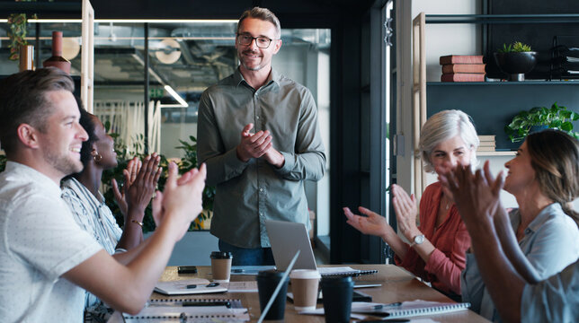 Happy man, team and applause for motivation at startup with celebration, goals and success at media company. People, speaker and clapping hands with smile, announcement and excited at creative agency