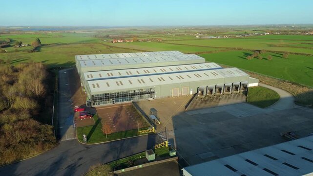 Aerial drone view of a large-scale industrial warehouse at Elean Business Park, Sutton, UK, showcasing modern logistics infrastructure.