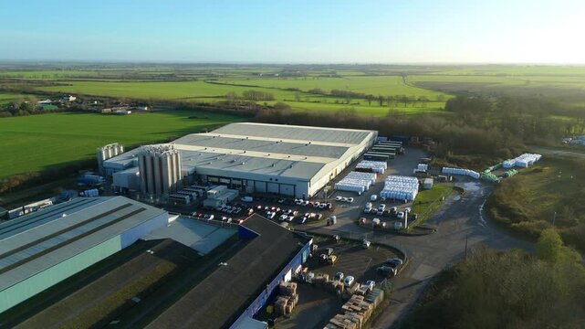 Cinematic drone footage of the expansive Elean Business Park, capturing the scale of distribution facilities and HGV transit bays