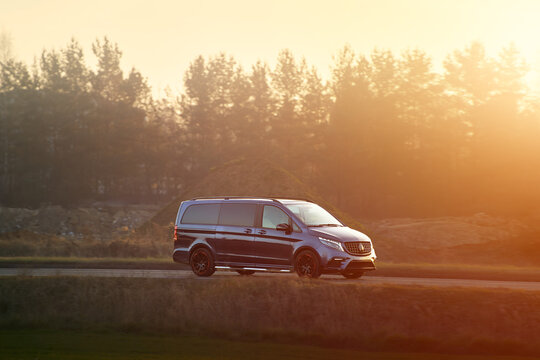 Passenger minivan on busy asphalt road