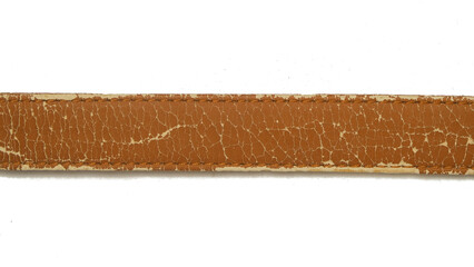 Close up of a brown synthetic leather belt that is damaged and peeling isolated on a white background. Grunge pattern and texture of the belt. Copy space for text. For graphic design, 3D rendering 